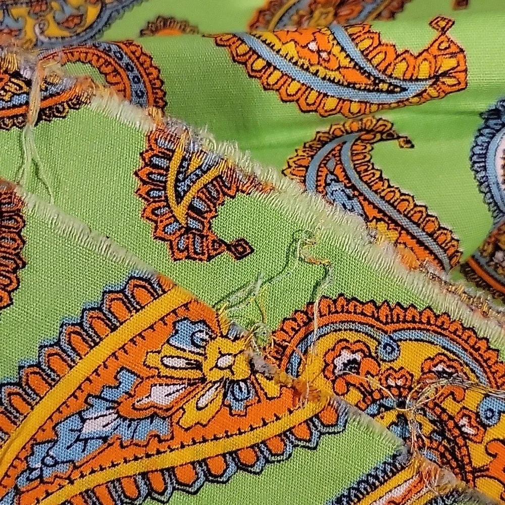 Green Paisley Floral print fabric with bold oranges and blues - 0.7 yrd